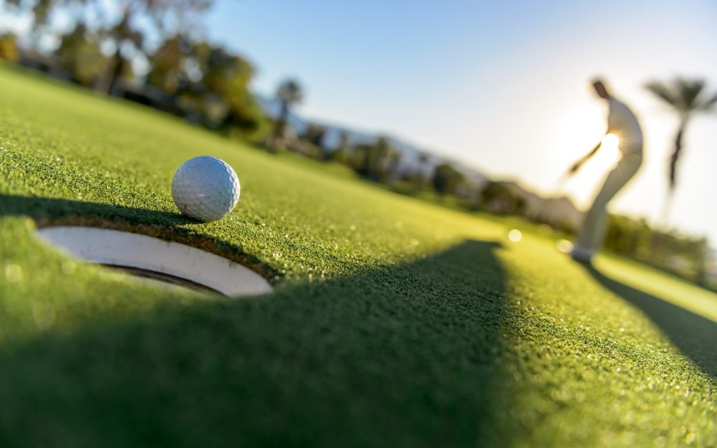 golfer near a hole